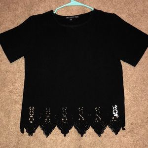 Black shirt with lace pattern at the bottom
